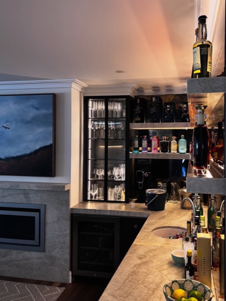 A home bar lit with feature lighting