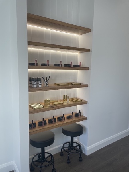 Retail shelving lit with LED strip lighting